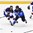 CHELYABINSK, RUSSIA - APRIL 19: Finland's Arttu Nevasaari #34 and Slovakia's Alexander Zekucia #5 chase down the puck during preliminary round action at the 2018 IIHF Ice Hockey U18 World Championship. (Photo by Andrea Cardin/HHOF-IIHF Images)

